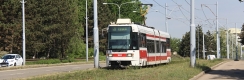 Vůz RT6N1 ev.č.1803 vypravený na linku x9 zachycený u zastávky Lesnická. | 18.5.2015