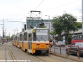 Ještě pohled opačným směrem do prostoru zastávky Puskás Ferenc Stadion na vjíždějící trojici vozů T5C5 ev.č.4246+4383+4269 na lince 1A. | 13.7.2012