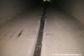 Dokončená betonová podlaha tunelu s odvodňovacím žlabem. | 10.7.2018