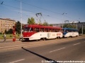 Souprava vozů T3 ev.č.6634+6635 vypravená na linku 22 opatřená slušivou celovozovou reklamou stanicuje v zastávce Kubánské náměstí. | 1993