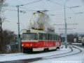 Vůz T3SUCS ev.č.7026 míří během zkušební jízdy do Ústředních dílen a odbočuje na most nad Černokosteleckou ulicí. | 18.2.2005