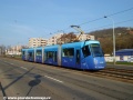 Vůz Škoda 14T #9152 opatřený celovozovou reklamou vypravený na linku 20 najíždí z vozovny Motol otevřeným svrškem tramvajové tratě přes Poštovku na svou trasu. | 3.4.2011