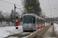 Zasněženou tramvajovou tratí míří přes Brusnici dnes již po nehodě vyřazený vůz Škoda 14T Elektra #9164 na lince 20. | 11.1.2010