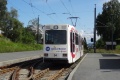 Pohled na zadní čelo vozu LHB GT6 #94, který opouští zastávku Munkvoll, kde se nachází vozovna a zdejší tramvajové muzeum. | 15.7.2023