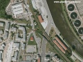 Letecký snímek již snesené železniční vlečky s ocelovým mostem přes ulici Pod Paťankou, a dvojici železobetonových mostů přes přeloženou Podbabskou ulici | 2003